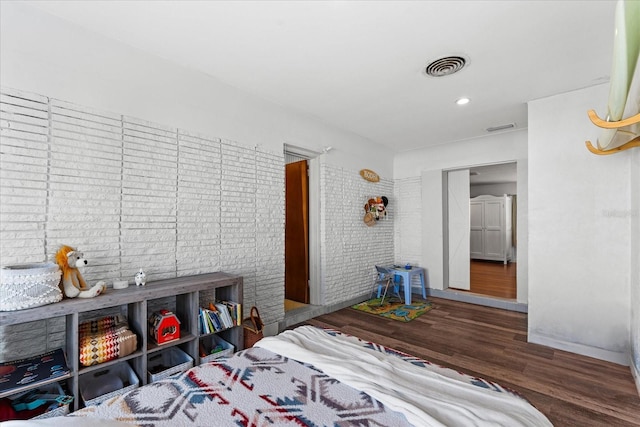 bedroom with recessed lighting, visible vents, and wood finished floors