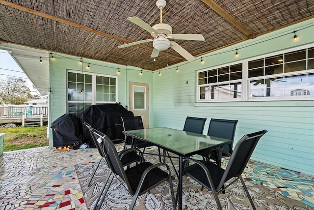 view of patio / terrace with a ceiling fan, outdoor dining space, a deck, and area for grilling