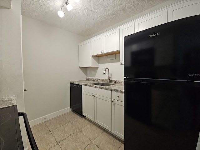 kitchen with light tile patterned floors, a textured ceiling, black appliances, white cabinetry, and a sink