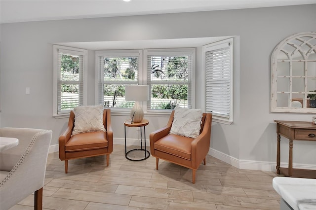 sitting room featuring baseboards and wood finish floors