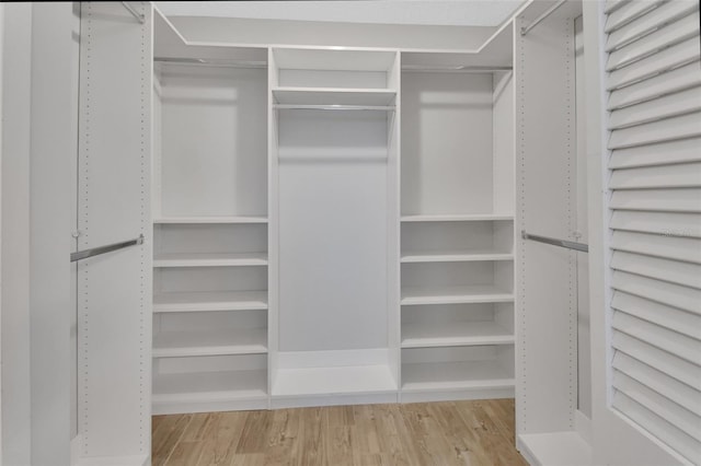 spacious closet with wood finished floors