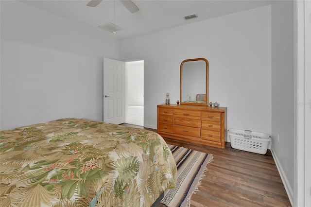 bedroom featuring ceiling fan, wood finished floors, and visible vents