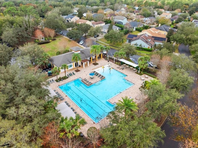 pool with a residential view and a patio area