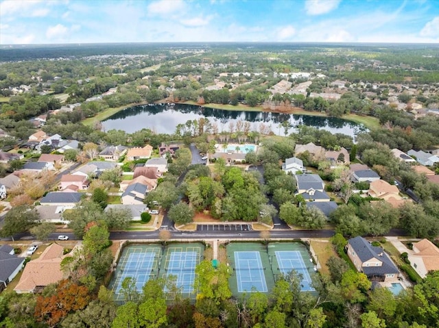 drone / aerial view featuring a water view and a residential view