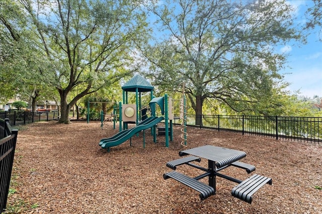 communal playground featuring fence