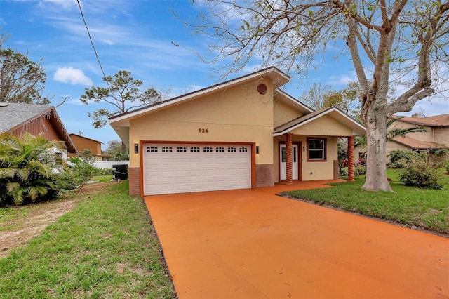 view of front of house featuring brick siding, central air condition unit, an attached garage, and stucco siding