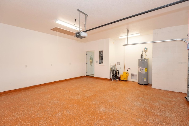 garage with baseboards, electric water heater, and a garage door opener