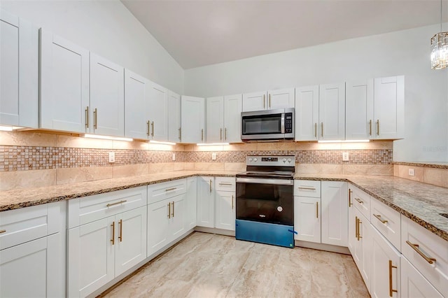 kitchen with tasteful backsplash, white cabinets, light stone counters, stainless steel appliances, and pendant lighting