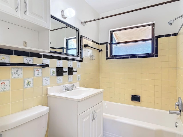 bathroom featuring shower / washtub combination, vanity, and toilet