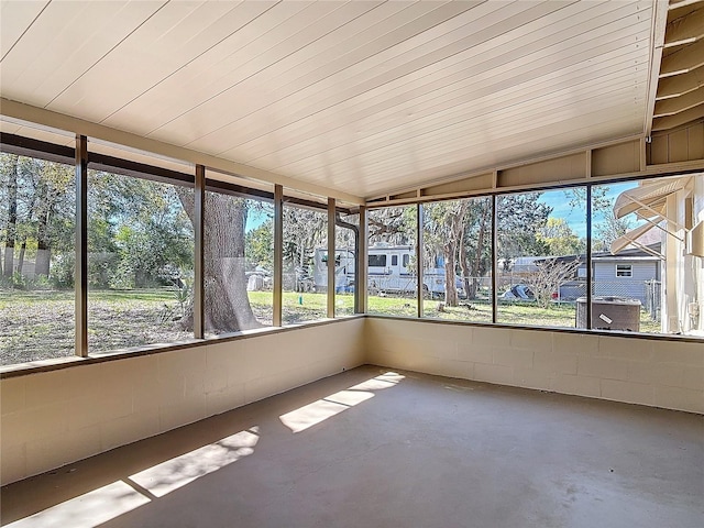 unfurnished sunroom with lofted ceiling and a healthy amount of sunlight