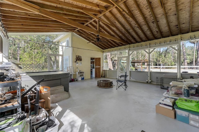 sunroom / solarium featuring lofted ceiling