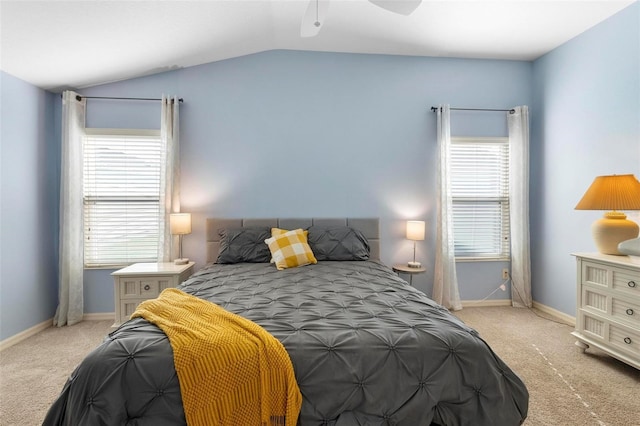 bedroom with lofted ceiling, ceiling fan, carpet flooring, and baseboards