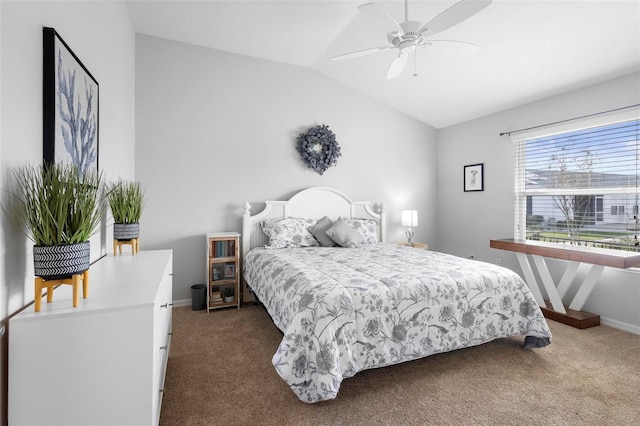 bedroom featuring lofted ceiling, carpet, baseboards, and ceiling fan