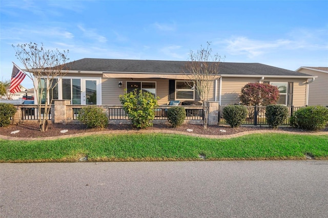 single story home featuring covered porch