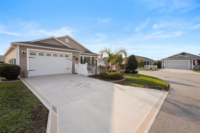 ranch-style house featuring driveway and an attached garage