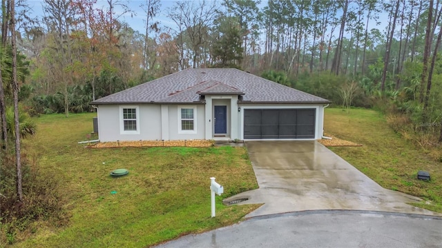 view of front facade with an attached garage, driveway, a shingled roof, and a front yard