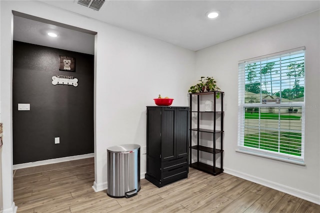 interior space featuring light wood finished floors, recessed lighting, visible vents, and baseboards