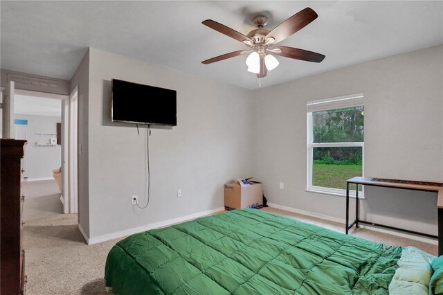 bedroom featuring light carpet, ceiling fan, and baseboards