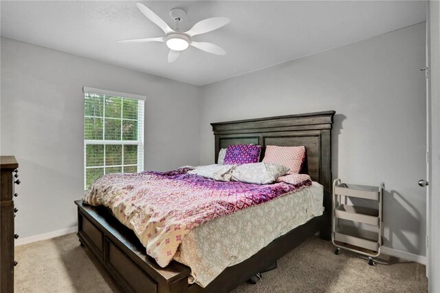 bedroom featuring a ceiling fan, carpet flooring, and baseboards