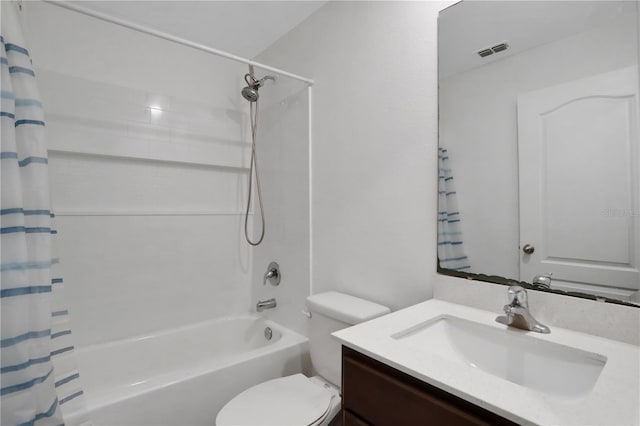 full bath with visible vents, vanity, toilet, and shower / bath combo with shower curtain