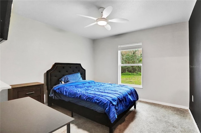 bedroom with carpet floors, baseboards, and a ceiling fan