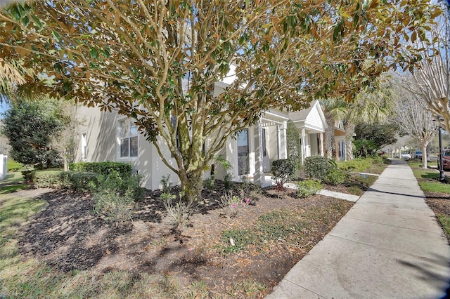 view of side of home featuring stucco siding