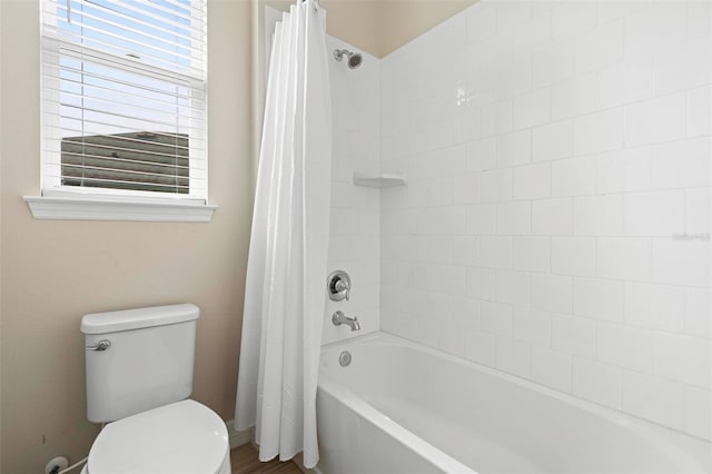 full bath with toilet and shower / tub combo