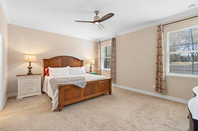 bedroom with ornamental molding, light colored carpet, baseboards, and a ceiling fan