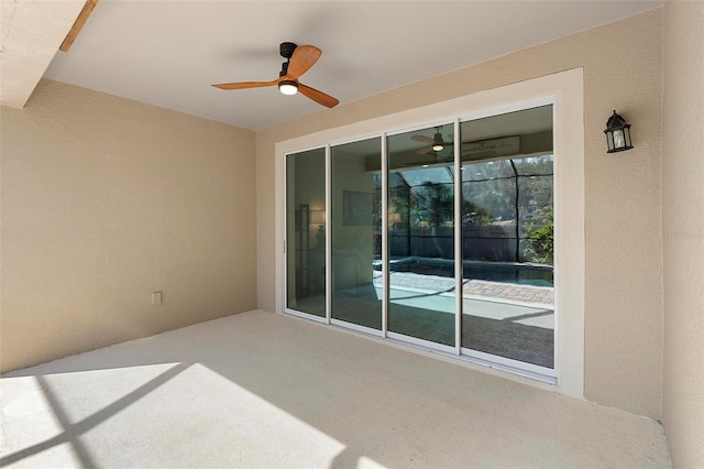 view of patio featuring a ceiling fan