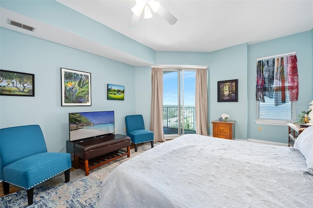 bedroom with a ceiling fan, visible vents, and access to exterior