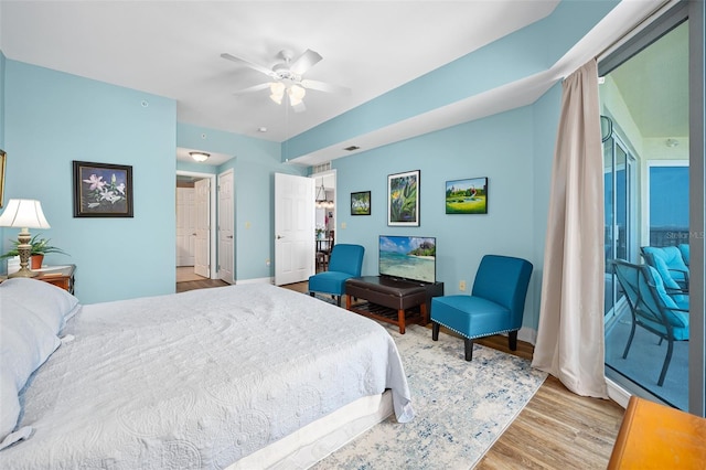 bedroom with light wood-type flooring and ceiling fan