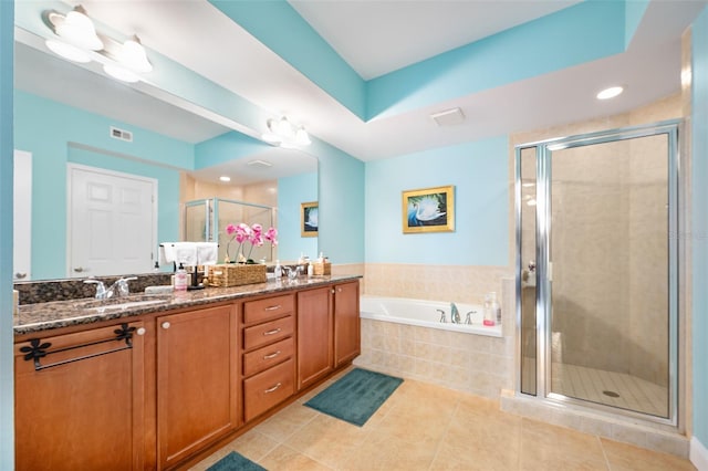 bathroom with visible vents, tile patterned floors, a sink, a shower stall, and a bath