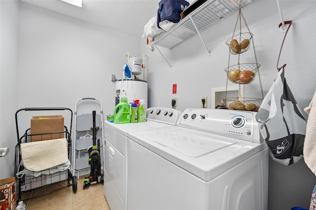 clothes washing area featuring laundry area, light tile patterned floors, and independent washer and dryer