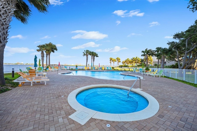 pool featuring a patio area and fence