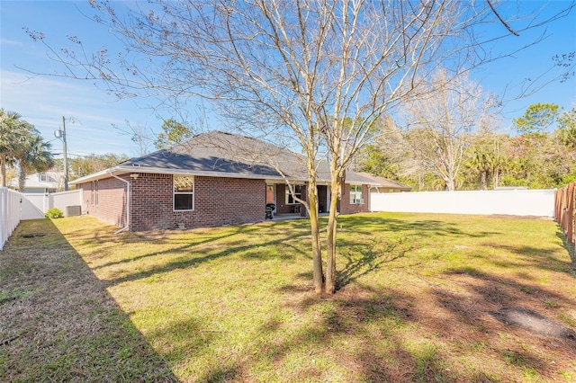 view of yard with a fenced backyard