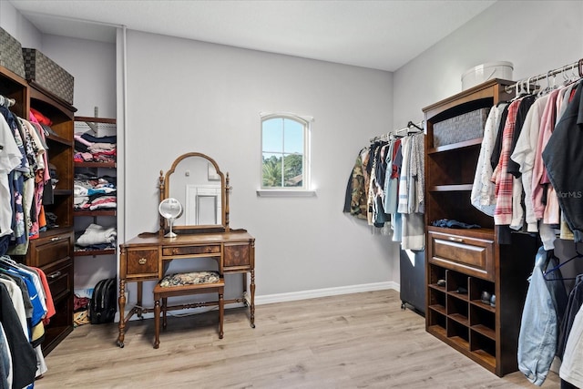 walk in closet featuring wood finished floors