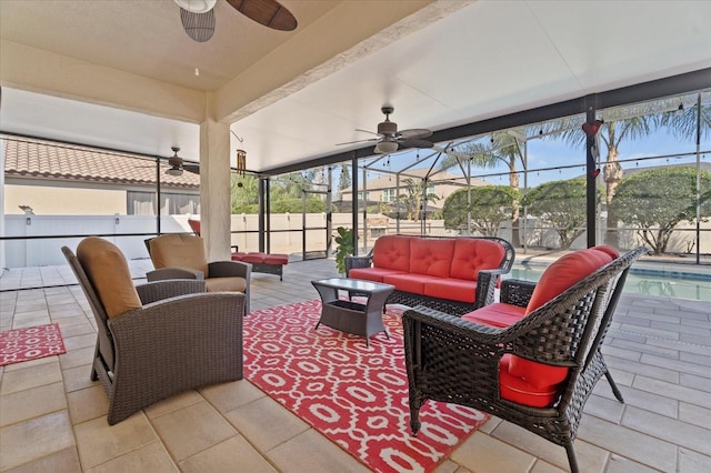 view of patio / terrace with an outdoor living space, a lanai, a fenced in pool, and a ceiling fan