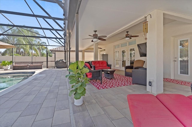 view of patio / terrace with glass enclosure, an outdoor living space, a ceiling fan, french doors, and a fenced in pool