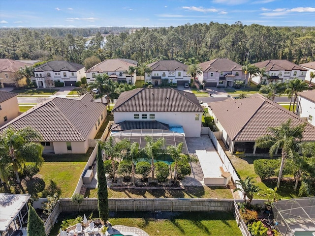 birds eye view of property with a residential view