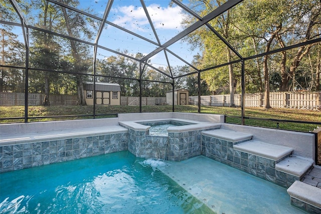 view of swimming pool featuring an outbuilding, glass enclosure, a fenced backyard, and a shed