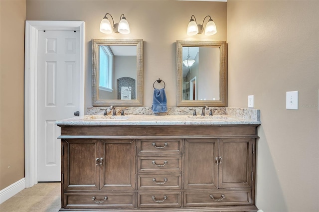 full bath featuring double vanity and a sink