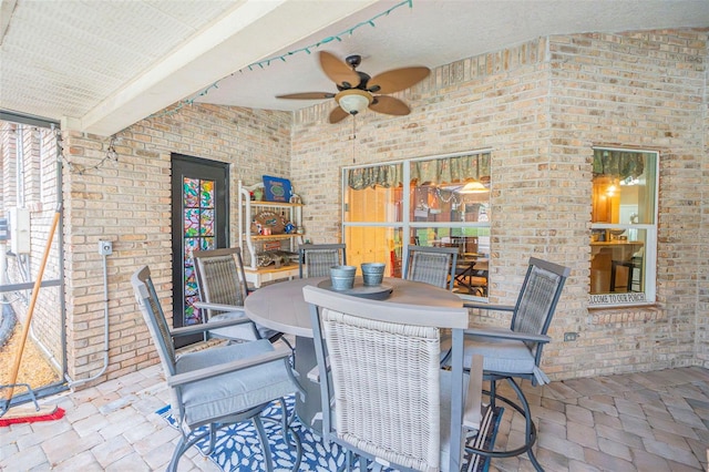 view of patio / terrace with ceiling fan and outdoor dining space