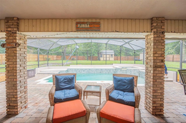 view of swimming pool with a patio area, a fenced backyard, and an outdoor structure