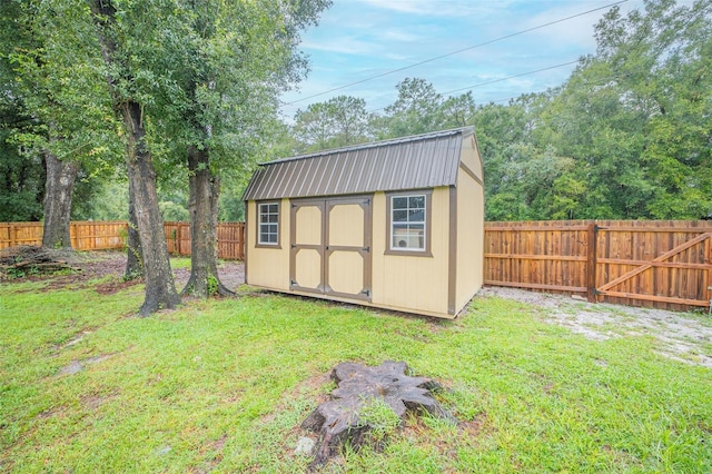 view of shed with a fenced backyard