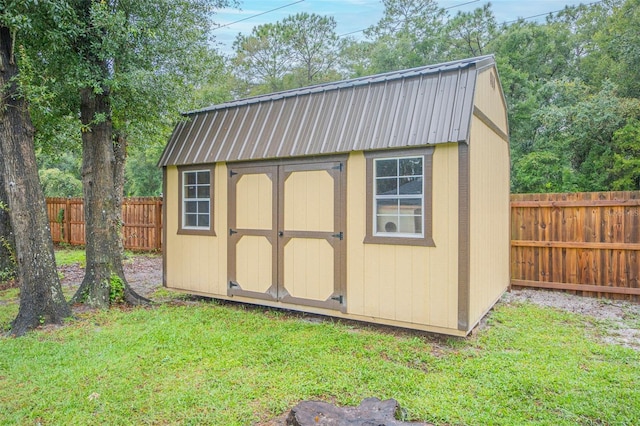 view of shed with a fenced backyard