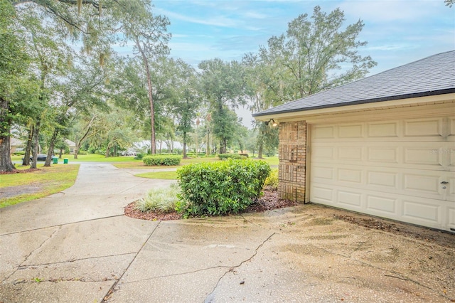 garage with concrete driveway