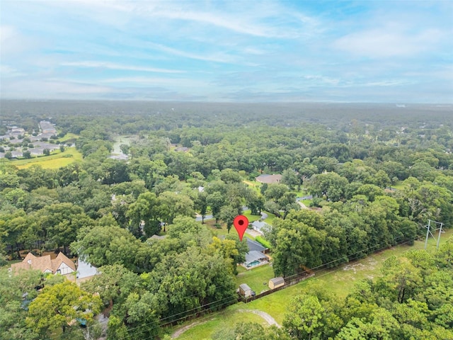 bird's eye view featuring a forest view