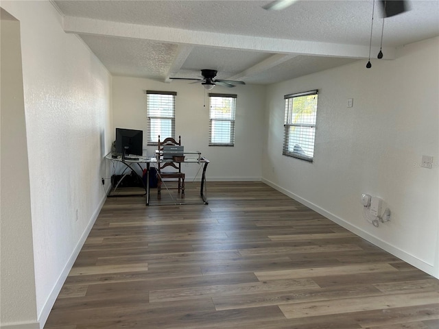 office featuring a textured wall, a textured ceiling, baseboards, and wood finished floors