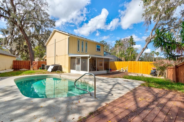 1118 Meditation Loop, Port Orange, FL 32129 - view of swimming pool with a sunroom, a fenced backyard, and a patio
