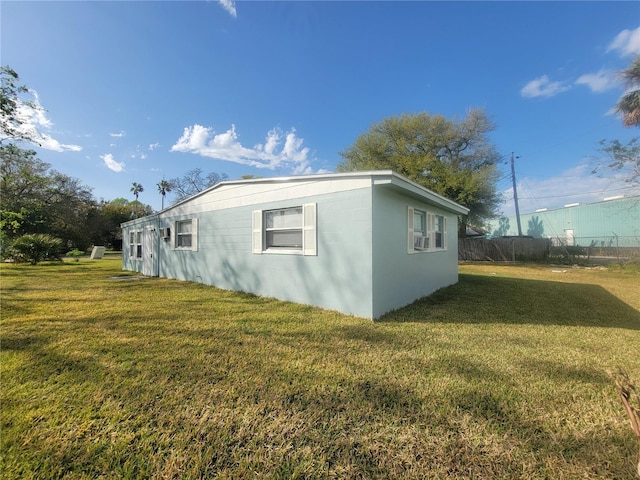 305 Elsie Ave, Daytona Beach, FL 32117 - view of home's exterior with a lawn and fence